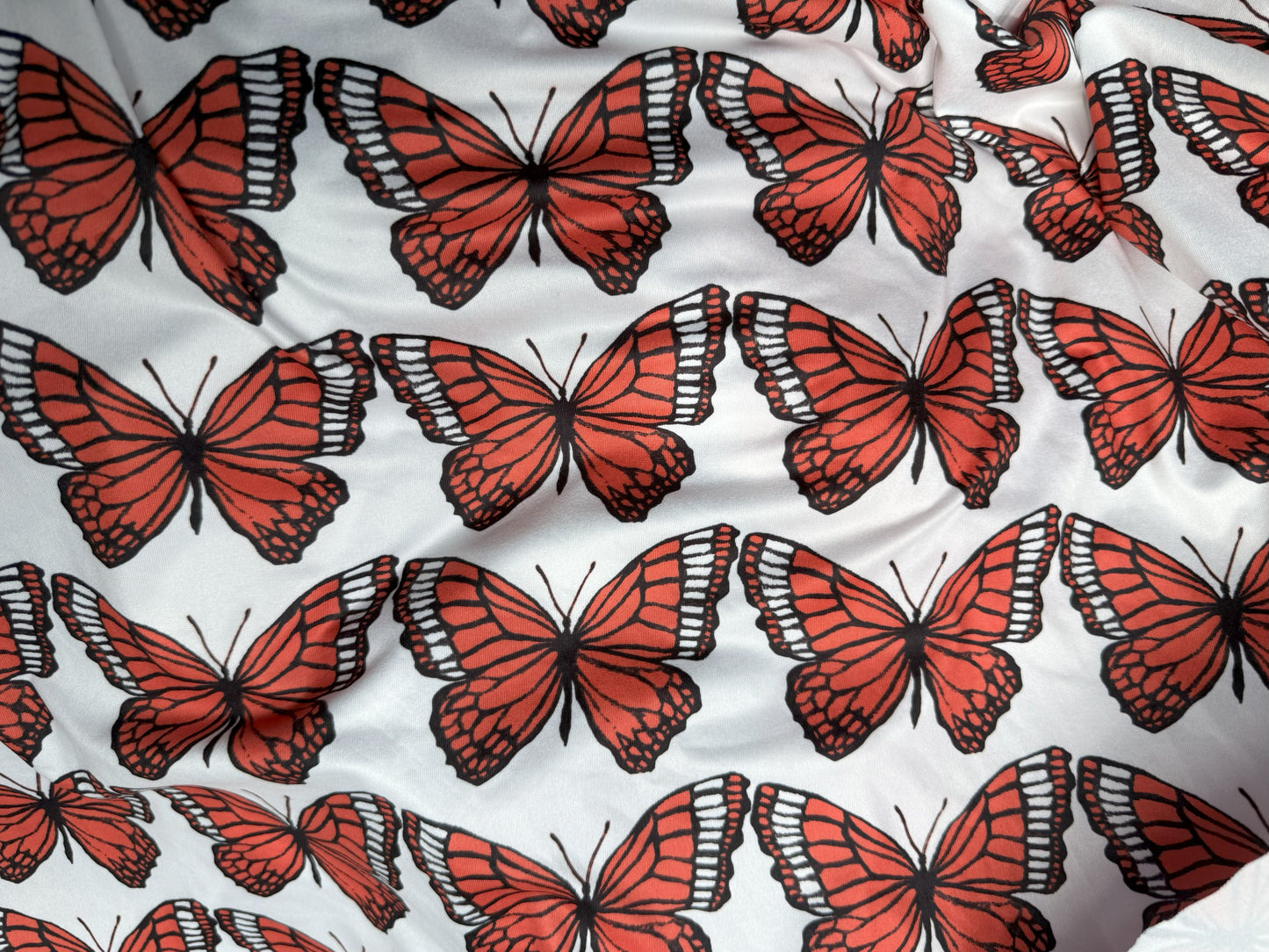 White Black Orange Butterfly Insect Stretch Polyester Spandex Jersey Knit "Flight of the Monarchs"